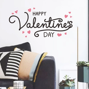 Detail showing Happy Valentine's Day wall stickers with pink hearts in a living room