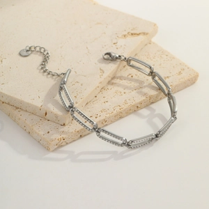 Detail of silver rectangle chain links with micro-paved white zircons and lobster clasp