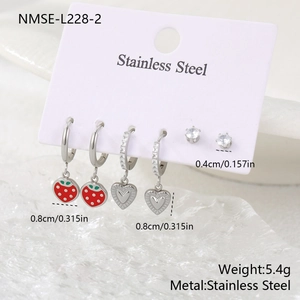 Detail view of stainless steel strawberry heart charms and zircon stud earrings set