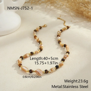 Detail view of Bohemian beaded necklace with starfish charms and natural shell textures