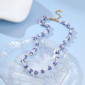 Blue and white floral ceramic bead necklace with pearls and gold adjustable clasp