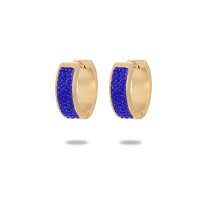Detailed macro view of gold huggie earrings with pavé set deep blue zircon stones