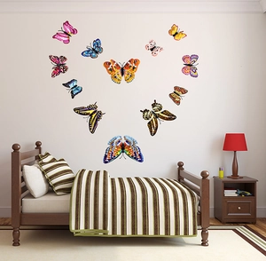 Luminous 3D double-layer butterfly wall stickers arranged in heart shape on a bedroom wall