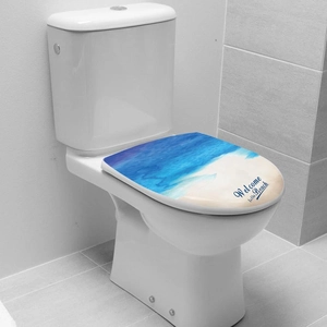 Detail of toilet seat lid sticker with ocean beach theme and Welcome to the Beach text