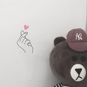 Creative minimalist heart hand gesture wall sticker for modern home decor styling