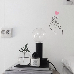 Minimalist heart gesture wall sticker for creative home decor and stylish interior wall art