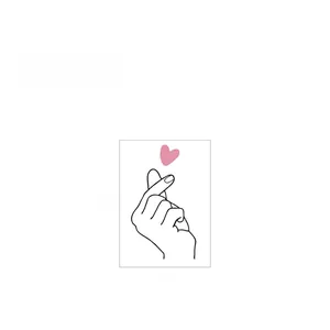 Detail of finger heart gesture wall sticker with pink heart measuring 14cm x 8cm