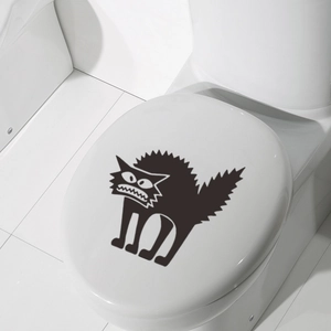 Scary black cat toilet lid sticker for spooky Halloween bathroom decor on white surface