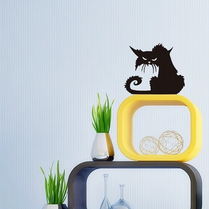 Detailed close-up of a spooky black cat silhouette wall sticker on a blue striped wall