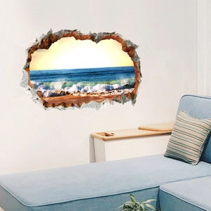 Detail of 3D broken wall decal showing realistic ocean beach landscape in a living room