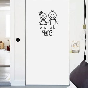 Minimalist cartoon WC boy and girl toilet sign sticker on a white wooden door