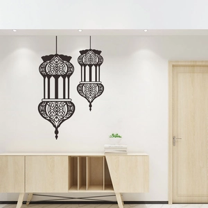 Detail of black PVC lantern wall decals with intricate geometric cutouts on white wall