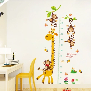 Detail of cartoon giraffe and monkey height chart sticker showing the scale from 60 to 180 cm