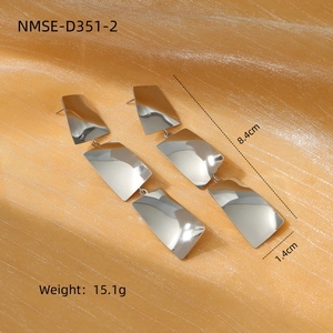 Detailed view of silver titanium steel drop earrings with size 8.4cm and weight 15.1g