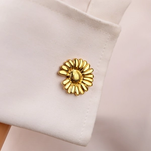 Elegant 18K gold butterfly daisy flower cufflinks on white French dress shirt cuff