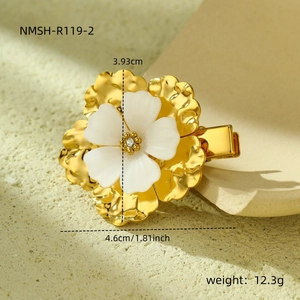 Detailed view of a gold-tone petal hair clip with pearls and size dimensions in inches