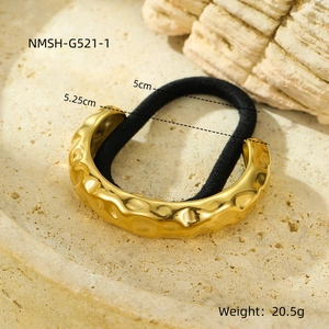 Golden hammer-textured stainless steel ponytail holder cuff with black elastic band