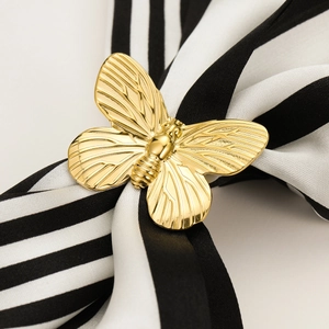 Elegant gold bow-shaped scarf buckle and ring in polished stainless steel for women