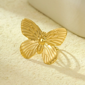 Elegant gold bow ring made of stainless steel featuring intricate butterfly wing textures