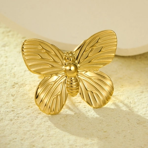 Detailed macro view of the golden bee design scarf ring with polished metal texture