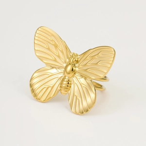 Detailed close-up of a golden butterfly scarf ring showing intricate wing textures