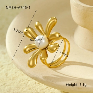 Macro view of gold flower silk scarf ring with pearl detail and exact dimensions