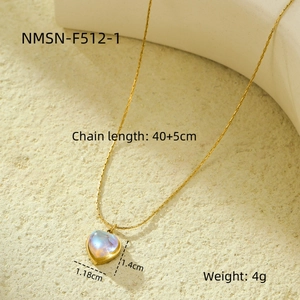 Close-up of heart moonstone pendant on gold 18K plated stainless steel necklace