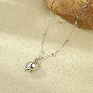 Minimalist stainless steel necklace with polished conch shell pendant and bead chain