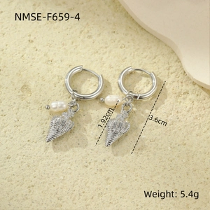 Detailed view of silver seashell pendant with round white pearl on stainless steel earrings
