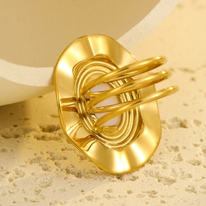 Detail of gold geometric oval ring featuring a modern triple-band layered design