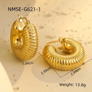 Detail of gold hollow chunky hoop earrings with textured finish and size measurements