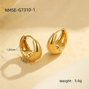 Detail view of gold hoop earrings on stone base showing 1.6cm outer diameter measurement