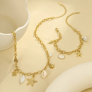 Gold shell starfish necklace and bracelet set with pearls for elegant beach vacation style