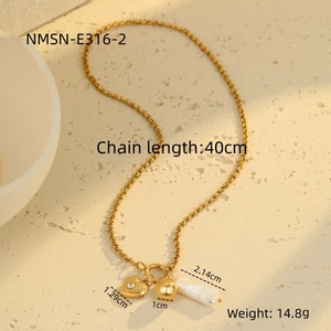 Detail view of gold necklace with heart charm, ball pendant, and dimensions annotation