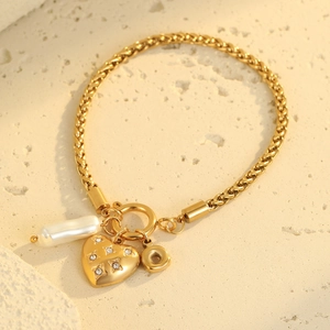 Gold stainless steel wheat chain bracelet with heart charm and baroque pearl accent