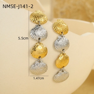 Macro shot of tiered 18k stainless steel shell earrings showing 5.5cm length detail
