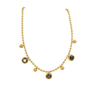 Multi-layered gold stainless steel anklet with dark gemstone and solid metal bead pendants