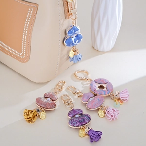 Handmade silk gourd and coin bag charms with pearls and tassels for luck