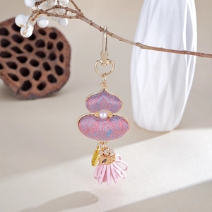 Handmade silk gourd charm with pearl accent and pink leather tassel for bags