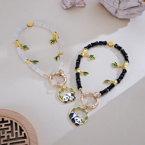 Bamboo beaded phone straps with cute panda charms and green enamel leaves