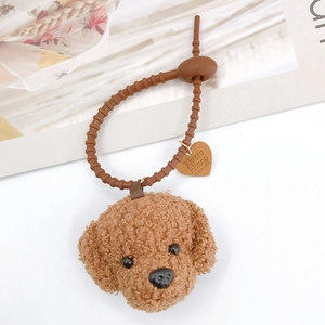 Brown plush teddy dog bag charm with adjustable strap and heart pendant accessory