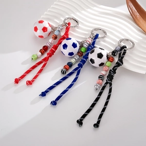 Handmade sports themed beaded keychains featuring soccer, basketball and tennis ball beads