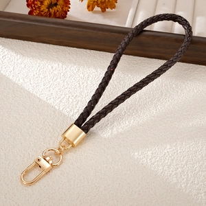 Hand-woven dark brown leather phone wrist strap with premium gold metal carabiner