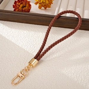 Handmade braided brown PU leather phone wrist strap with gold metal lobster clasp detail