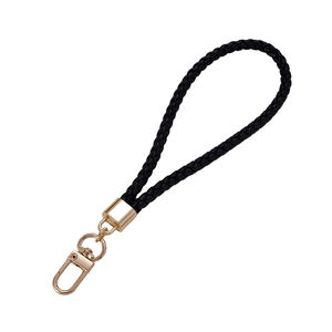 Braided black leather phone wrist strap with a polished light gold rotating spring hook clasp