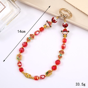 Chinese style crystal beaded phone charm with red god of wealth and gold ingot
