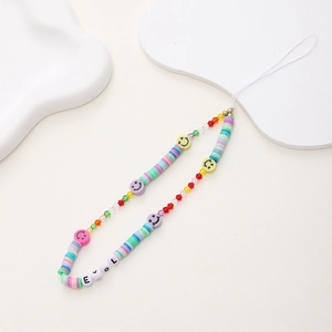 Detail of handmade colorful heishi bead phone strap with LOVE letters and smiley faces