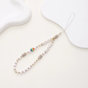 Detail of beaded phone strap featuring golden LOVE letter beads and colorful accents