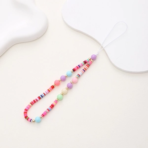 Detail of colorful polymer clay and beaded phone charm strap with macaron tones
