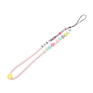 Handmade clay bead phone strap with heart beads and LOVE letter charms on white background